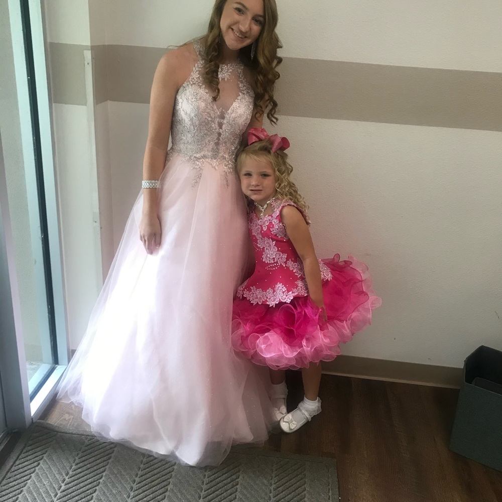 Beautiful pink, poofy pageant/prom dress.